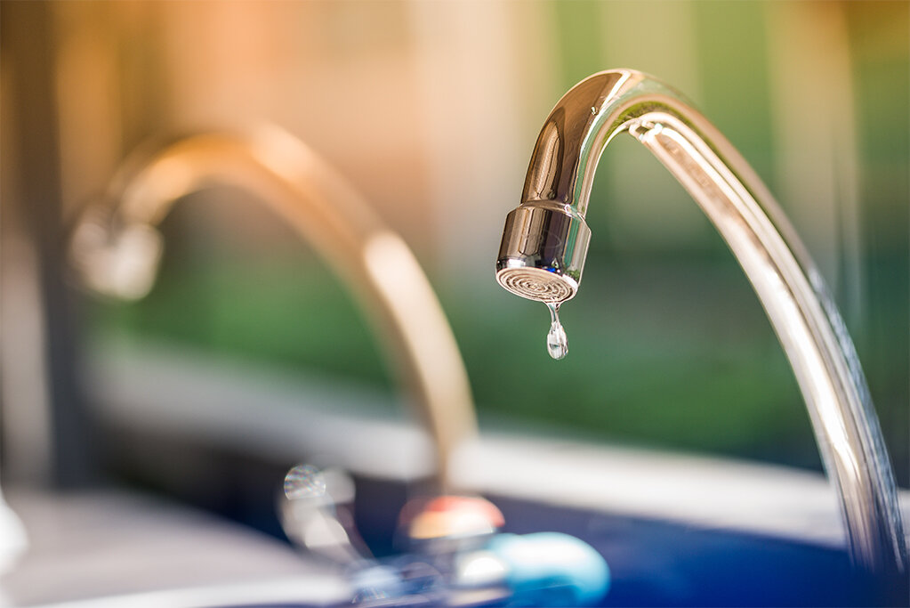 Close-up of a dripping faucet